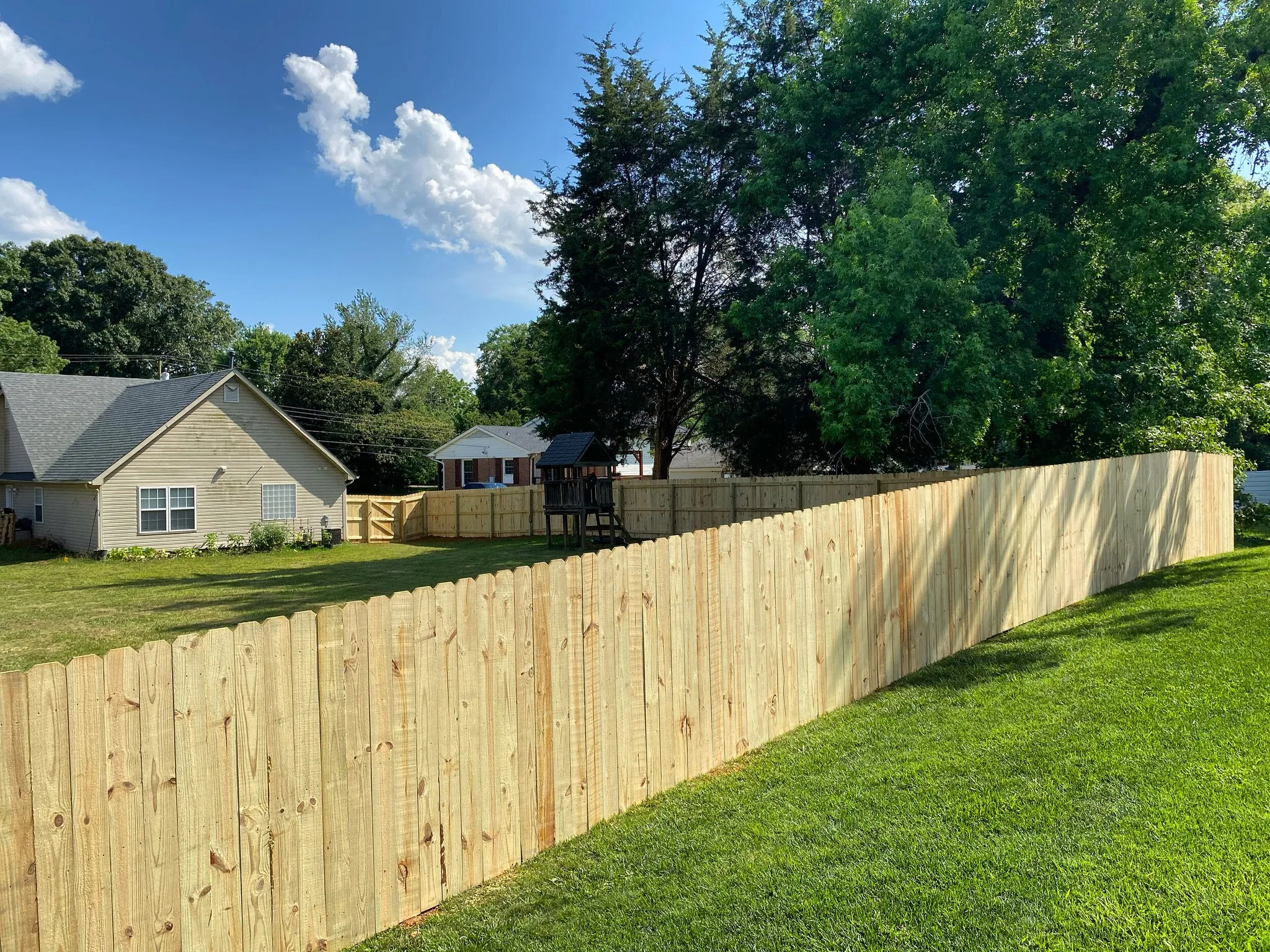 Wooden privacy fence installation