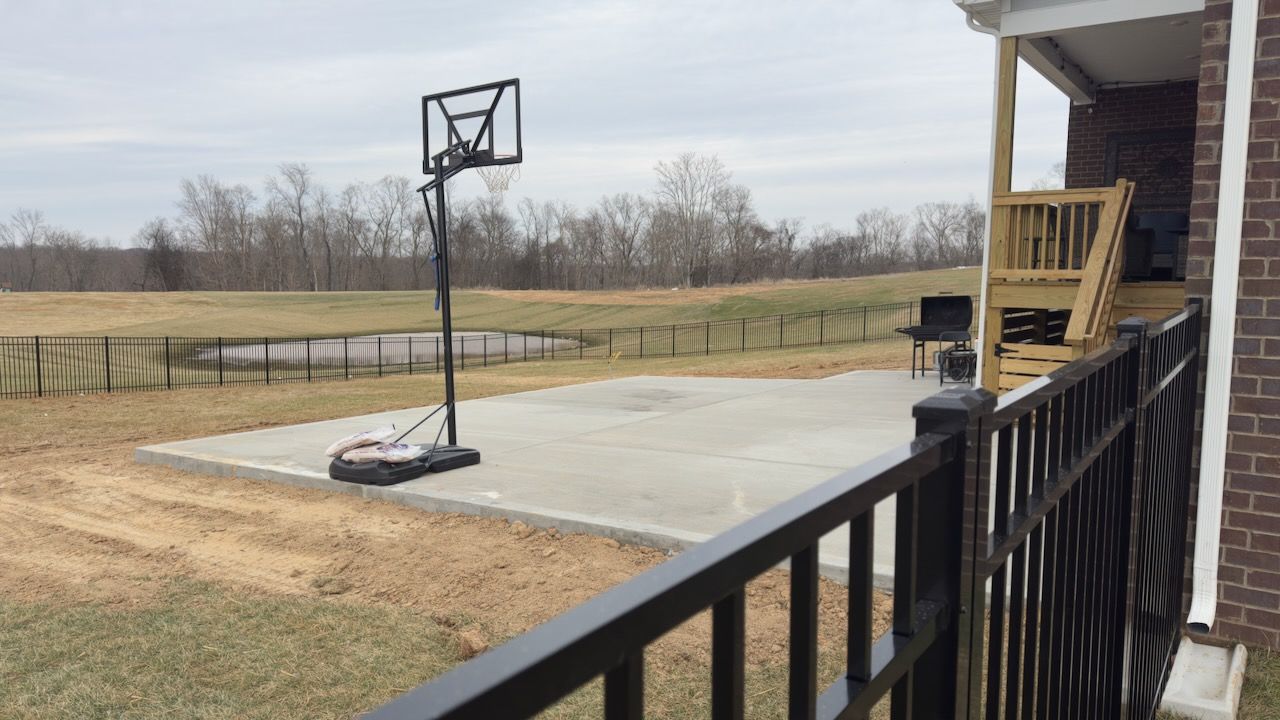 Large concrete patio slab installed next to back porch in Clarksville, TN