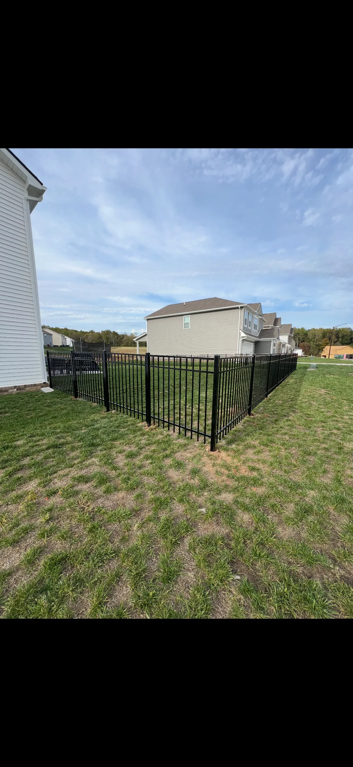 Wooden privacy fence installation